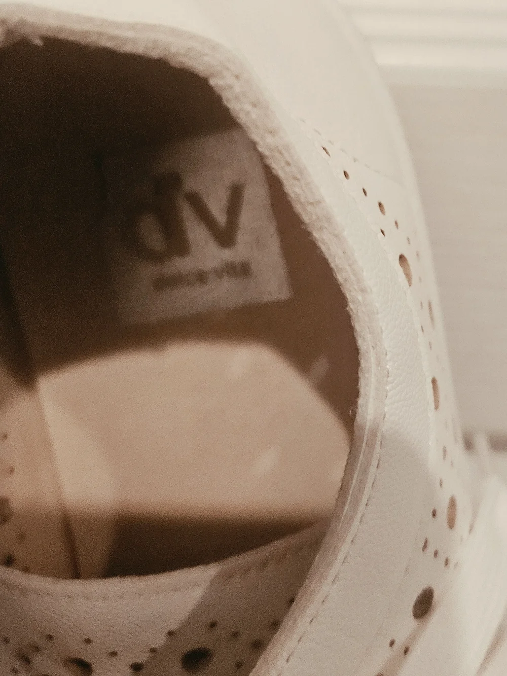 DV by Dolce Vita White Perforated Lace-Up Sneakers with Gold Eyelets